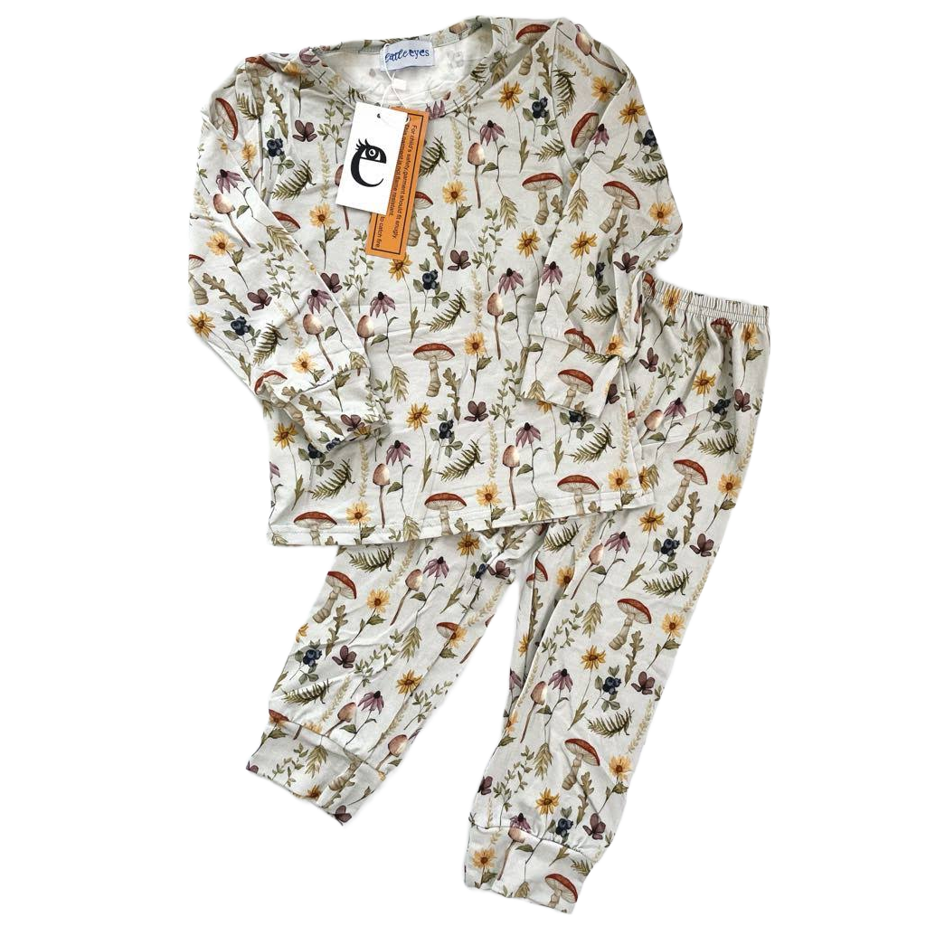 Kids floral bamboo pajama outfit with wildflowers, mushrooms, and plants